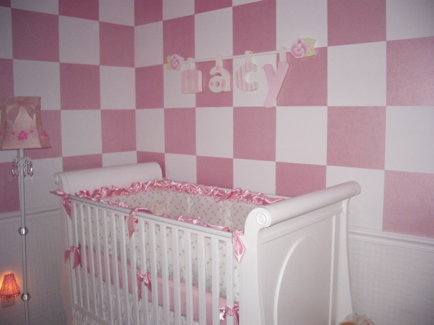 Macy's Nursery is painted in pearlized pink checkerboard