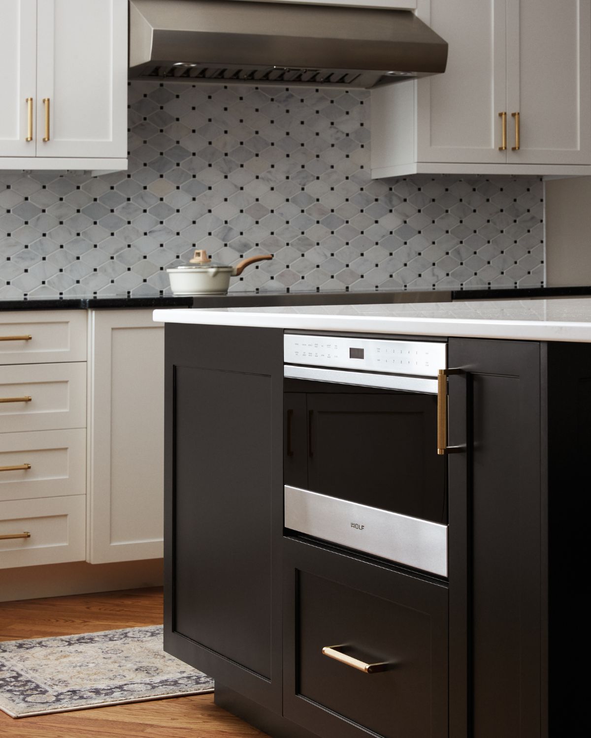 Built-in microwave drawer in the island of a custom kitchen in Ambler