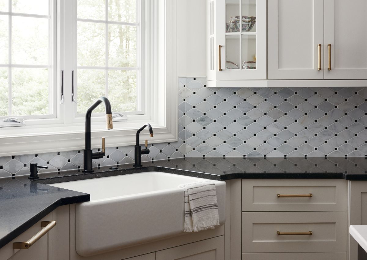 Carrera and black marble backsplash in newly renovated kitchen in Ambler