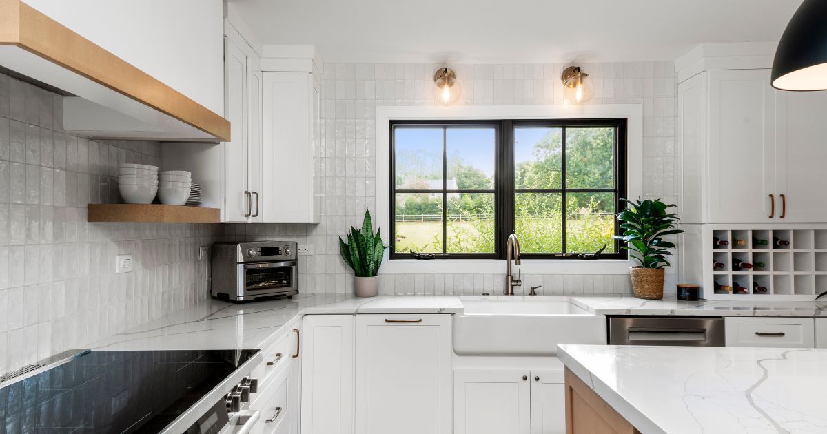 Farmhouse sink with glose light fixtures in Bucks County renovated kitchen