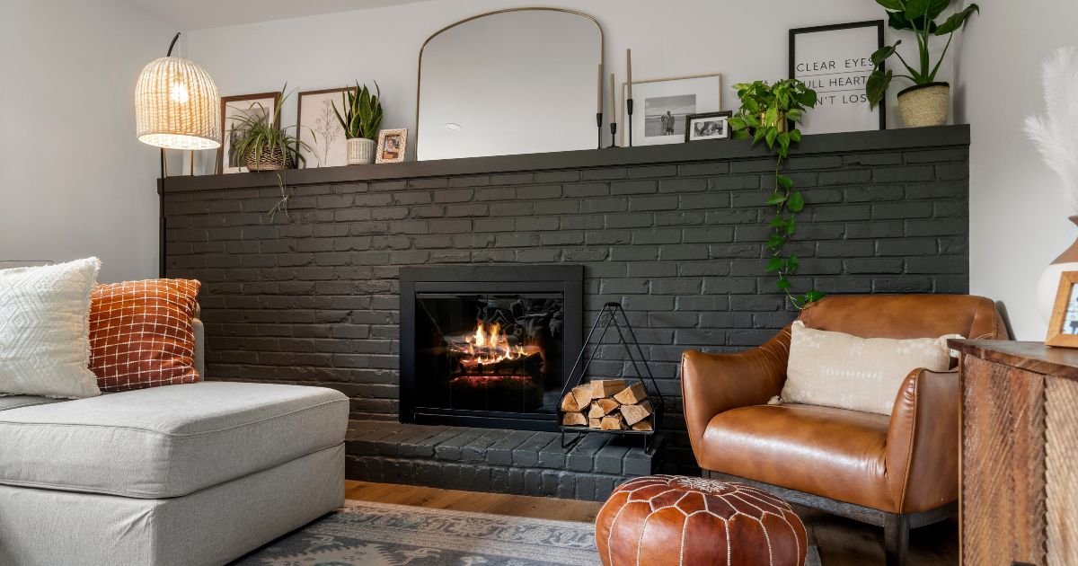 Dark painted brick fireplace in Bucks County renovated home