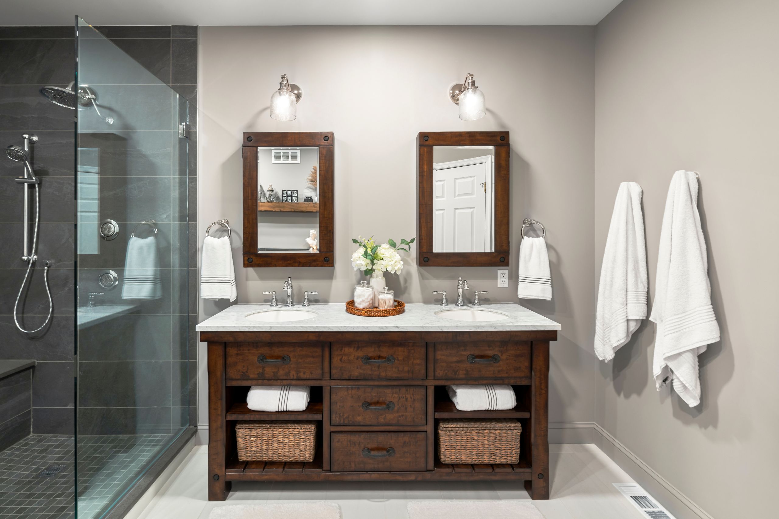 Dark wood double vanity in a black and white bathroom remodel