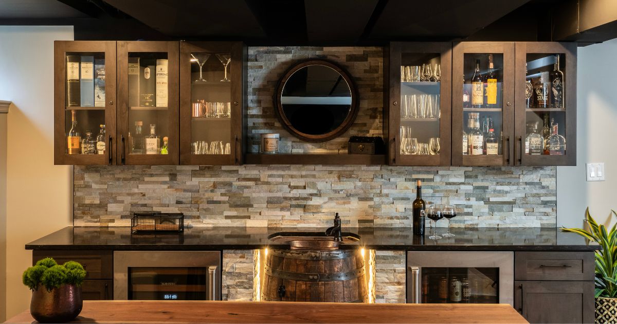 Full view of basement bar with barrel sink and under cabinet lighting in Montgomery County, PA