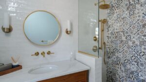 Mosaic tile shower in a newly renovated primary bathroom