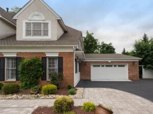 Exterior of a brick home with a garage that was added on for an addition