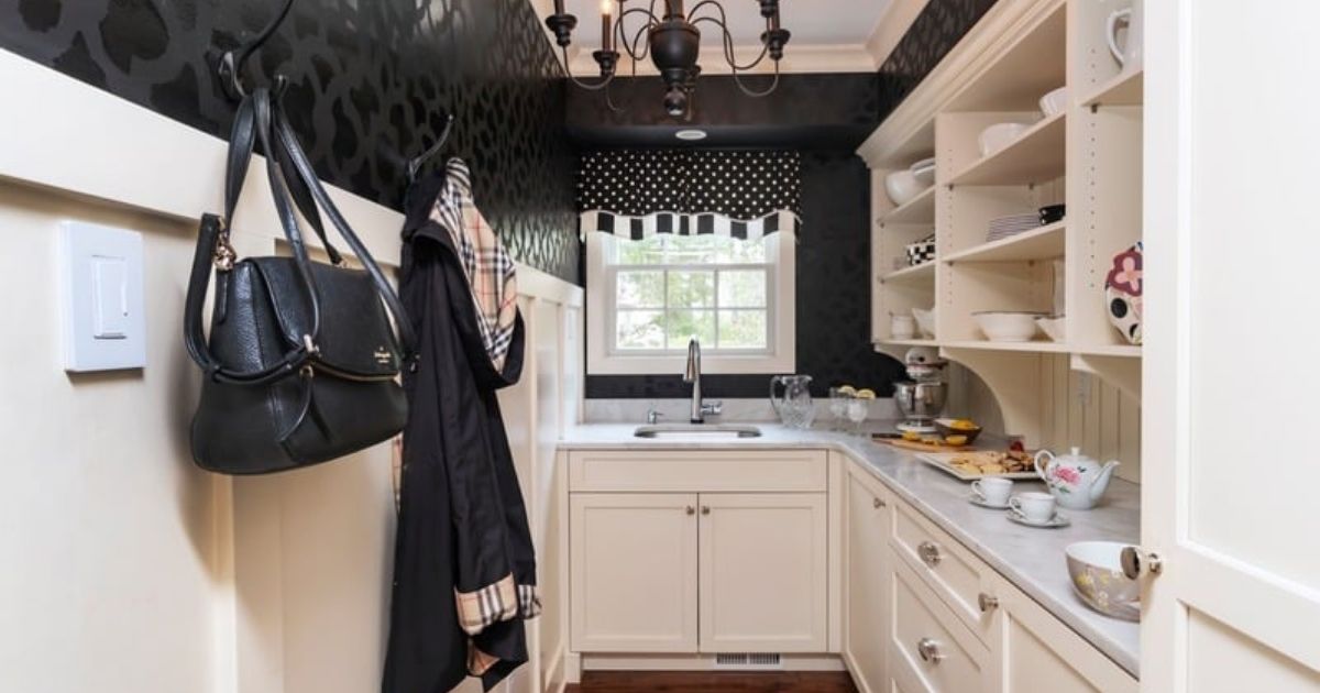 Butler's Pantry with chandelier and patterned wallpaper