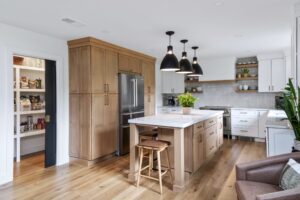 Remodeled kitchen with walk in pantry with pocket door
