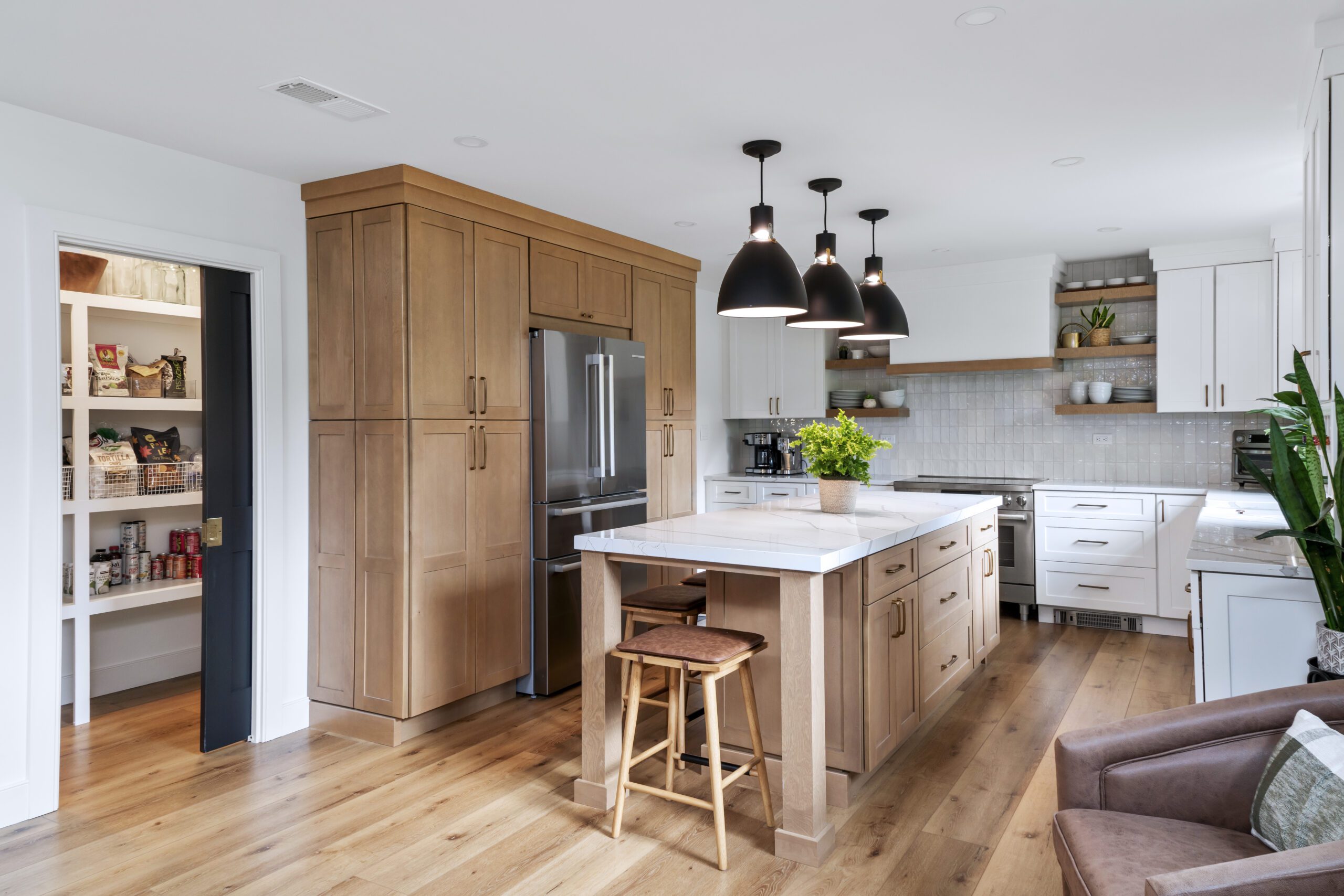 Remodeled kitchen with walk in pantry with pocket door