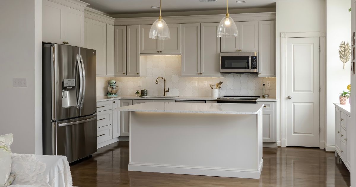 Remodeled kitchen with light taupe cabinetry and modern applicances