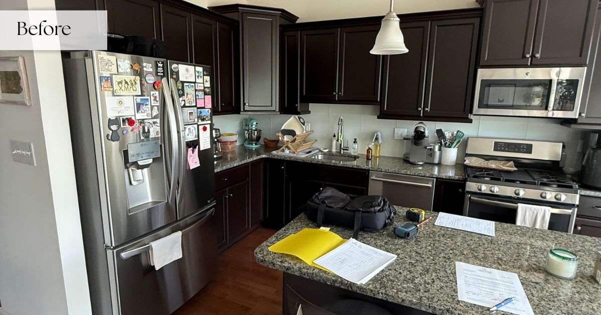 Before pic of a kitchen with dark cabinets.