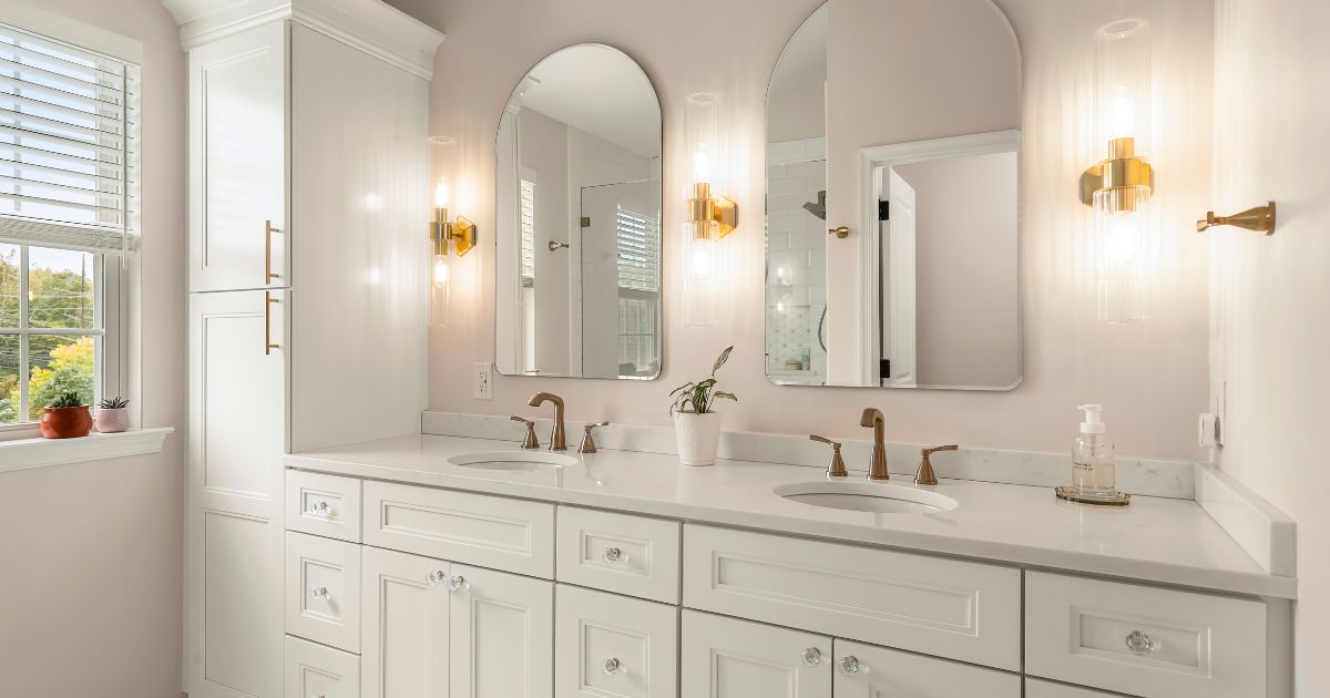 white bathroom with double vanity and glass knobs