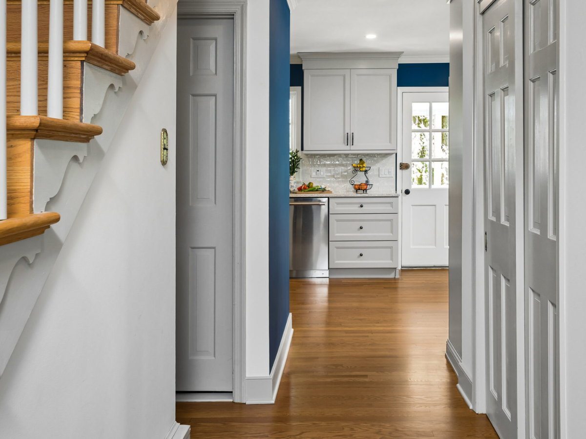 Rydal remodel stair view with blue walls and hardwood floors