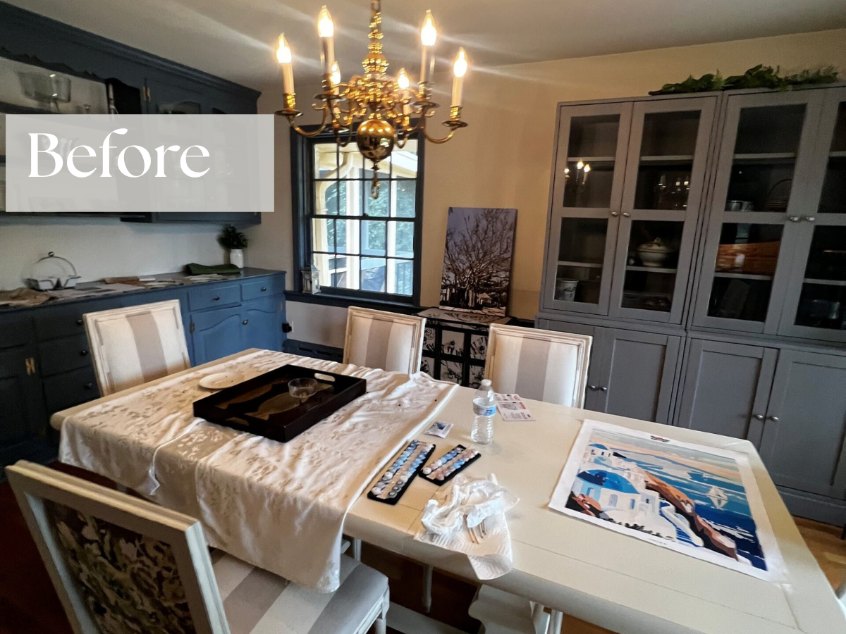 Dining room with table, china cabinet and candle chandelier 
